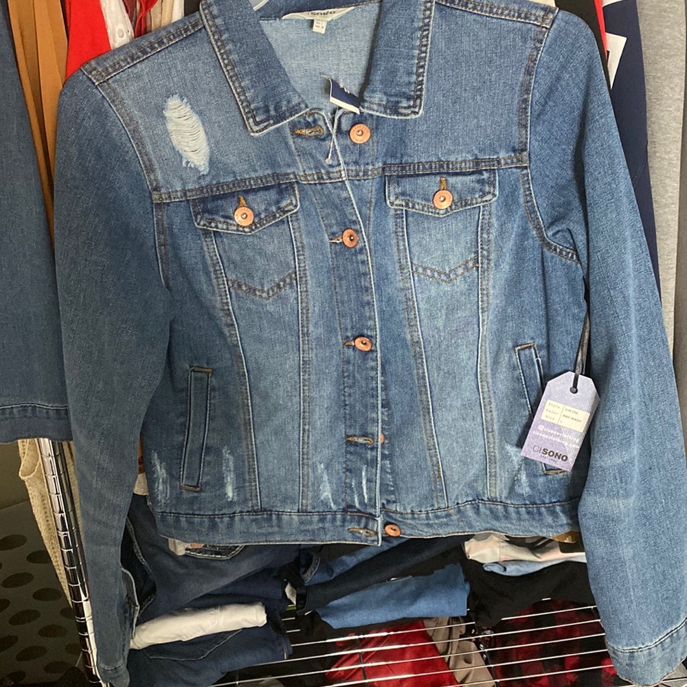 Brand new jean jacket never worn fits like a medium